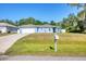Charming single-story home with a two-car garage and well-maintained lawn in a quiet neighborhood at 2821 Embassy Rd, North Port, FL 34291