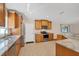 Well-equipped kitchen with stainless steel appliances, granite counters, and tile floors at 2821 Embassy Rd, North Port, FL 34291