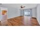 Living room features wood floors and sliding glass doors to patio, with adjacent kitchen at 2821 Embassy Rd, North Port, FL 34291