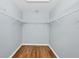 Walk-in closet with wood floors and built in shelving for maximum storage at 2821 Embassy Rd, North Port, FL 34291