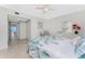 A bedroom featuring tiled floors, coastal decor and a beautiful water view from the hallway at 2955 N Beach Rd # D113, Englewood, FL 34223