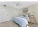Bedroom with tile floors, wicker furniture and coastal themed decor at 2955 N Beach Rd # D113, Englewood, FL 34223