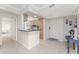 Kitchen showcases cozy wooden cabinets, tile backsplash, and a breakfast bar, blending functionality with coastal charm at 2955 N Beach Rd # D113, Englewood, FL 34223
