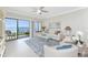 Sun-lit living room with sliding glass doors to a patio and calming water views, complete with stylish seating at 2955 N Beach Rd # D113, Englewood, FL 34223