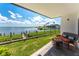 Outdoor seating area with scenic waterfront views and lush greenery at 2955 N Beach Rd # D113, Englewood, FL 34223