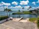 Beautiful waterfront property and boat launch area with palm trees at 2955 N Beach Rd # D113, Englewood, FL 34223
