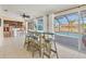 Open concept dining area connects the kitchen to the pool area, with stools, table and chairs for dining at 30 Buccaneer Bnd, Placida, FL 33946