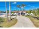 Charming home with a circular driveway and well-maintained landscaping at 30 Buccaneer Bnd, Placida, FL 33946