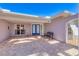 Charming home entryway features a beautiful brick patio and a vibrant blue front door at 30 Buccaneer Bnd, Placida, FL 33946