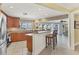 Open kitchen area with a breakfast bar, views of the dining area, and natural light at 30 Buccaneer Bnd, Placida, FL 33946