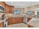 Well-appointed kitchen features custom cabinetry, granite countertops, and stainless steel appliances at 30 Buccaneer Bnd, Placida, FL 33946