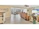 Bright and airy living room with tile floors, comfortable seating, and seamless access to the screened lanai at 30 Buccaneer Bnd, Placida, FL 33946