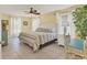 Bright and airy main bedroom features tile floors, ceiling fan, and natural light at 30 Buccaneer Bnd, Placida, FL 33946
