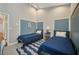 A well-lit bedroom featuring two twin beds, modern decor, and a cozy atmosphere for a restful night's sleep at 3511 Bay Ridge Way, Port Charlotte, FL 33953