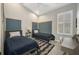 Comfortable bedroom with a calming color scheme, vaulted ceiling, and ample natural light, creating a relaxing space at 3511 Bay Ridge Way, Port Charlotte, FL 33953