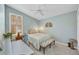Bedroom with neutral color scheme, ceiling fan, wood blinds, and accent furniture at 3511 Bay Ridge Way, Port Charlotte, FL 33953