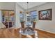 Breakfast nook with views of the screened-in lanai and backyard, filled with natural light at 3511 Bay Ridge Way, Port Charlotte, FL 33953
