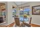 Cozy breakfast nook with a view of the pool and screened-in lanai at 3511 Bay Ridge Way, Port Charlotte, FL 33953