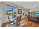 Breakfast nook with large windows overlooking the lush, green backyard at 3511 Bay Ridge Way, Port Charlotte, FL 33953