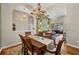 Open concept dining room adjacent to a living room with high ceilings, light and bright at 3511 Bay Ridge Way, Port Charlotte, FL 33953