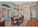 Formal dining room with a chandelier and arched windows at 3511 Bay Ridge Way, Port Charlotte, FL 33953