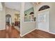 View of front door and adjacent dining area with hardwood floors at 3511 Bay Ridge Way, Port Charlotte, FL 33953
