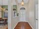Welcoming foyer with wood floors, arched doorways, and natural light at 3511 Bay Ridge Way, Port Charlotte, FL 33953