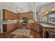 Kitchen with granite countertops, stainless steel appliances, and wood cabinets at 3511 Bay Ridge Way, Port Charlotte, FL 33953