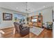 Bright living room with hardwood floors, large windows, and comfortable seating for relaxing and entertaining at 3511 Bay Ridge Way, Port Charlotte, FL 33953