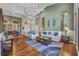 Inviting living room with high ceilings, decorative wall art, and sliding glass doors to backyard at 3511 Bay Ridge Way, Port Charlotte, FL 33953