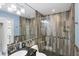 Contemporary bathroom featuring a glass shower, mosaic tile accents, and modern fixtures at 44 Waterford Dr, Englewood, FL 34223