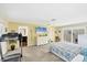 Bright bedroom with a bed, tv, and en-suite bathroom at 44 Waterford Dr, Englewood, FL 34223