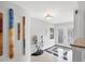 Bright foyer with decorative tile flooring, glass table, and unique wall art, offering a welcoming entrance at 44 Waterford Dr, Englewood, FL 34223