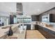 Spacious kitchen featuring modern appliances, ample counter space, and stylish cabinetry with a scenic view at 44 Waterford Dr, Englewood, FL 34223