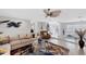 Inviting living area with stylish decor, tile floors, and open layout connecting to other living spaces at 44 Waterford Dr, Englewood, FL 34223