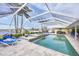 Stunning pool and spa area with a screened enclosure, perfect for enjoying the outdoors year-round at 44 Waterford Dr, Englewood, FL 34223