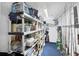 Organized storage room with shelving units and ample space for storage at 44 Waterford Dr, Englewood, FL 34223