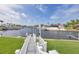 Beautiful waterfront view with a private dock, providing the perfect setting for boating and relaxation at 44 Waterford Dr, Englewood, FL 34223