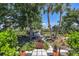 Beautiful waterfront property featuring a charming walkway leading to a boat dock and water access at 4624 Pompano St, Placida, FL 33946