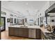 Gourmet kitchen with a large island, stainless steel appliances, and seamless open-concept layout at 4624 Pompano St, Placida, FL 33946