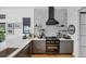 Well-appointed kitchen with modern cabinets, stainless steel appliances, and sleek countertops at 4624 Pompano St, Placida, FL 33946