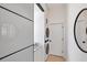 The laundry room with stacked washer and dryer offers convenience and style with modern finishes at 4624 Pompano St, Placida, FL 33946