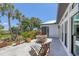 Relaxing backyard patio area perfect for outdoor dining and enjoying scenic views with lush landscaping at 4624 Pompano St, Placida, FL 33946