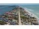 Aerial view of a coastal condominium complex with a pool near the beach at 5055 N Beach Rd # 208, Englewood, FL 34223