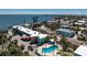 Waterfront complex with swimming pool and tropical landscaping at 5055 N Beach Rd # 208, Englewood, FL 34223