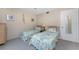 Bedroom with two twin beds and ocean-themed bedding at 5055 N Beach Rd # 208, Englewood, FL 34223