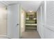 This is a closet with open shelving and a small desk area at 5055 N Beach Rd # 208, Englewood, FL 34223