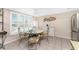 Well-lit dining area features a round table, comfortable seating and lots of natural sunlight at 5055 N Beach Rd # 208, Englewood, FL 34223