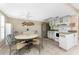 Eat in kitchen with tile floors, neutral paint colors, and ceiling fan at 5055 N Beach Rd # 208, Englewood, FL 34223