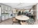 An eat-in kitchen with tiled floors adjoins an open-plan living room and dining area at 5055 N Beach Rd # 208, Englewood, FL 34223